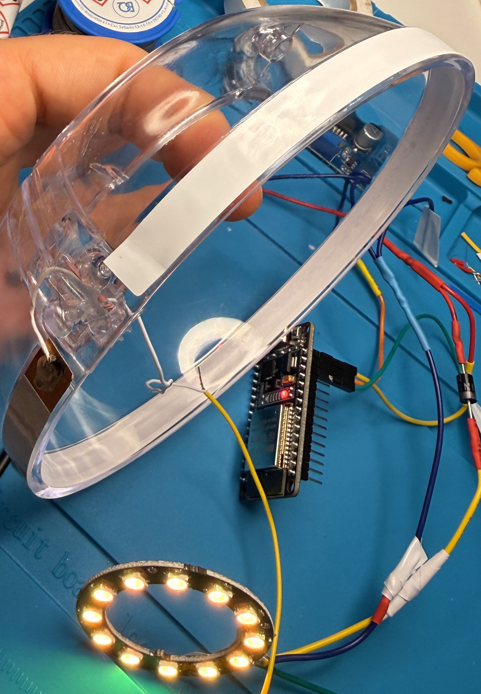The copper tape touch pad stuck to the inside wall of the clear egg half
