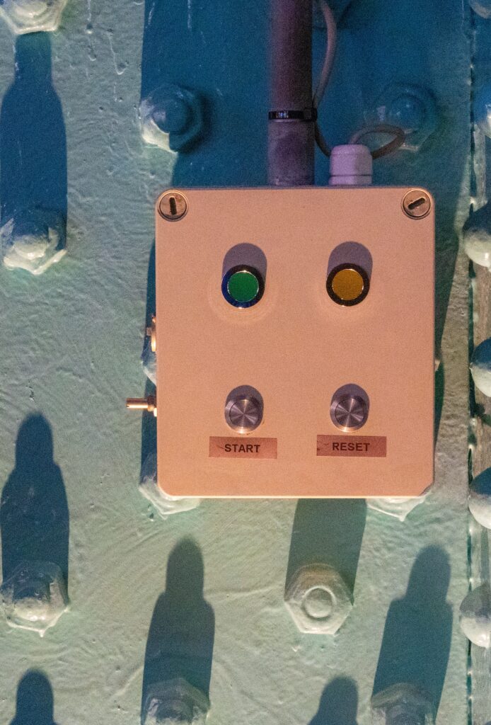 Electrical control box with green START and amber RESET buttons