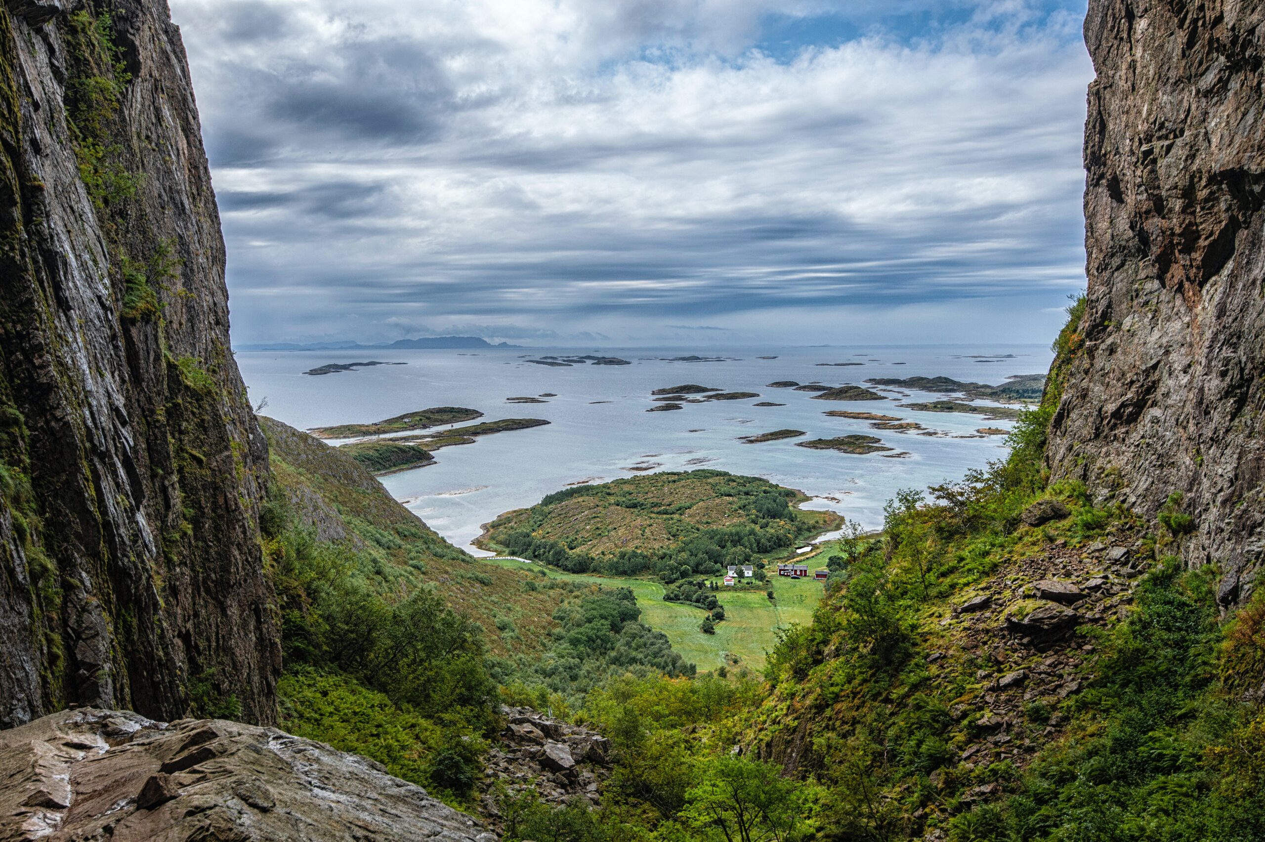 Tranquil image of green grass and a small lake, photographed from a mountain