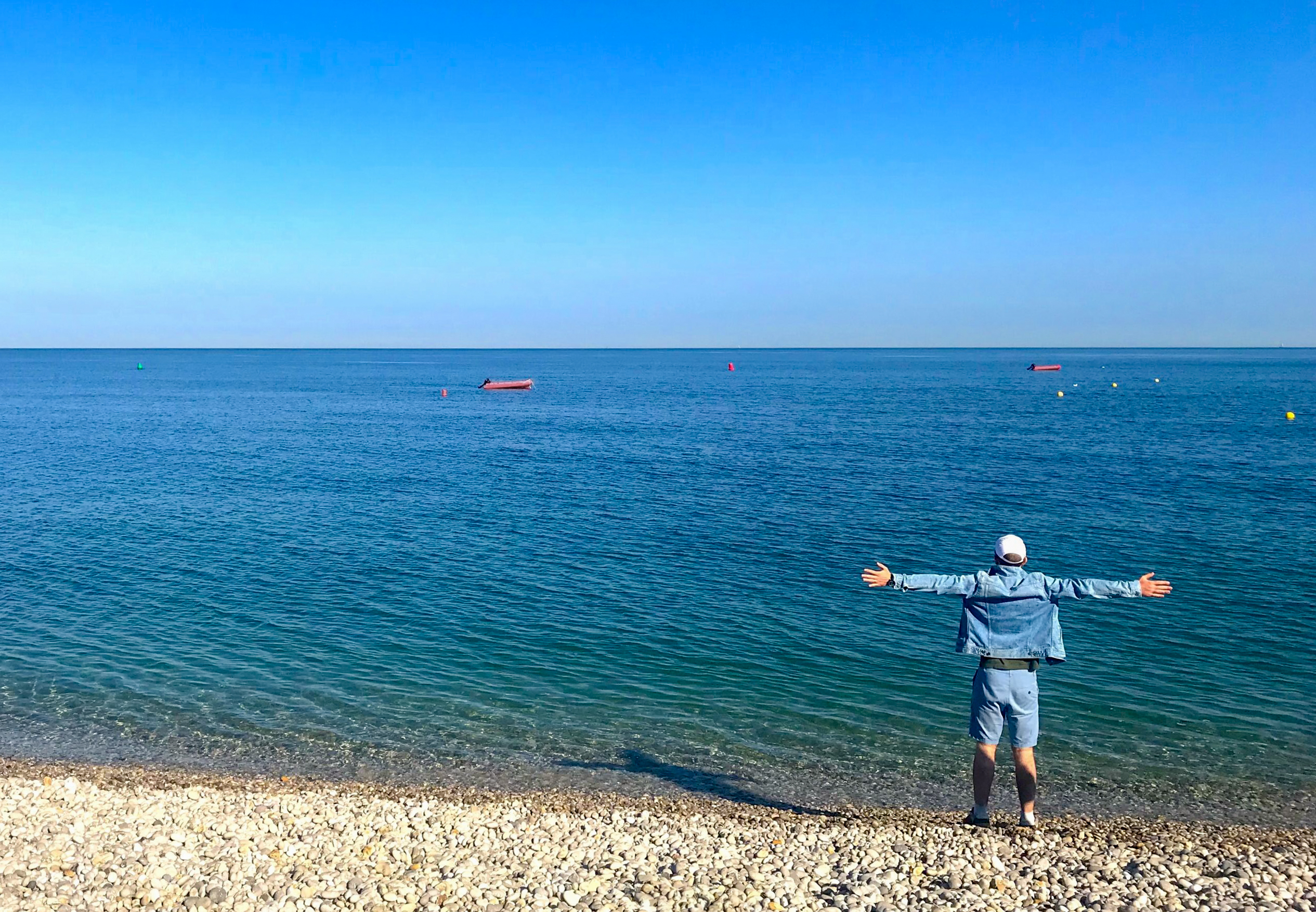 Igor looking at a sea with hands wide open